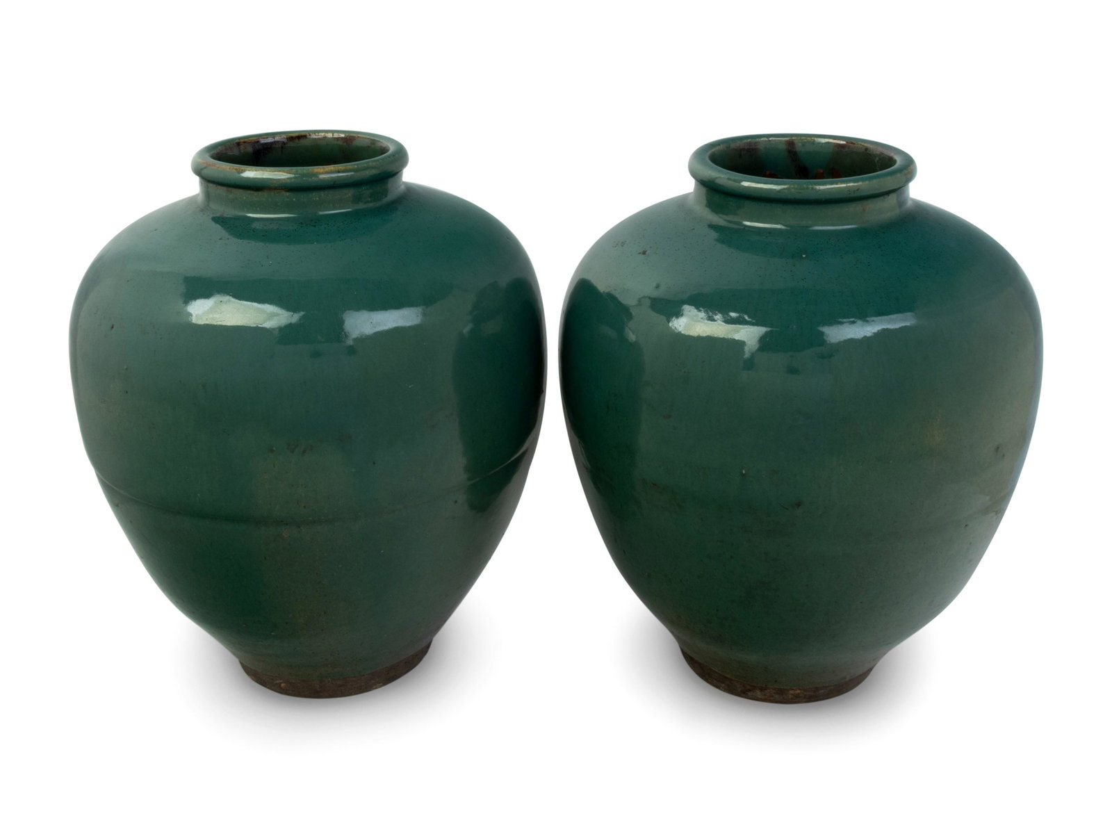 A Pair of Green Glazed Porcelain Vases: A Pair of Green Glazed Porcelain Vases Height 14 inches. Property from the Estate of John D. Fornengo, Chicago, Illinois