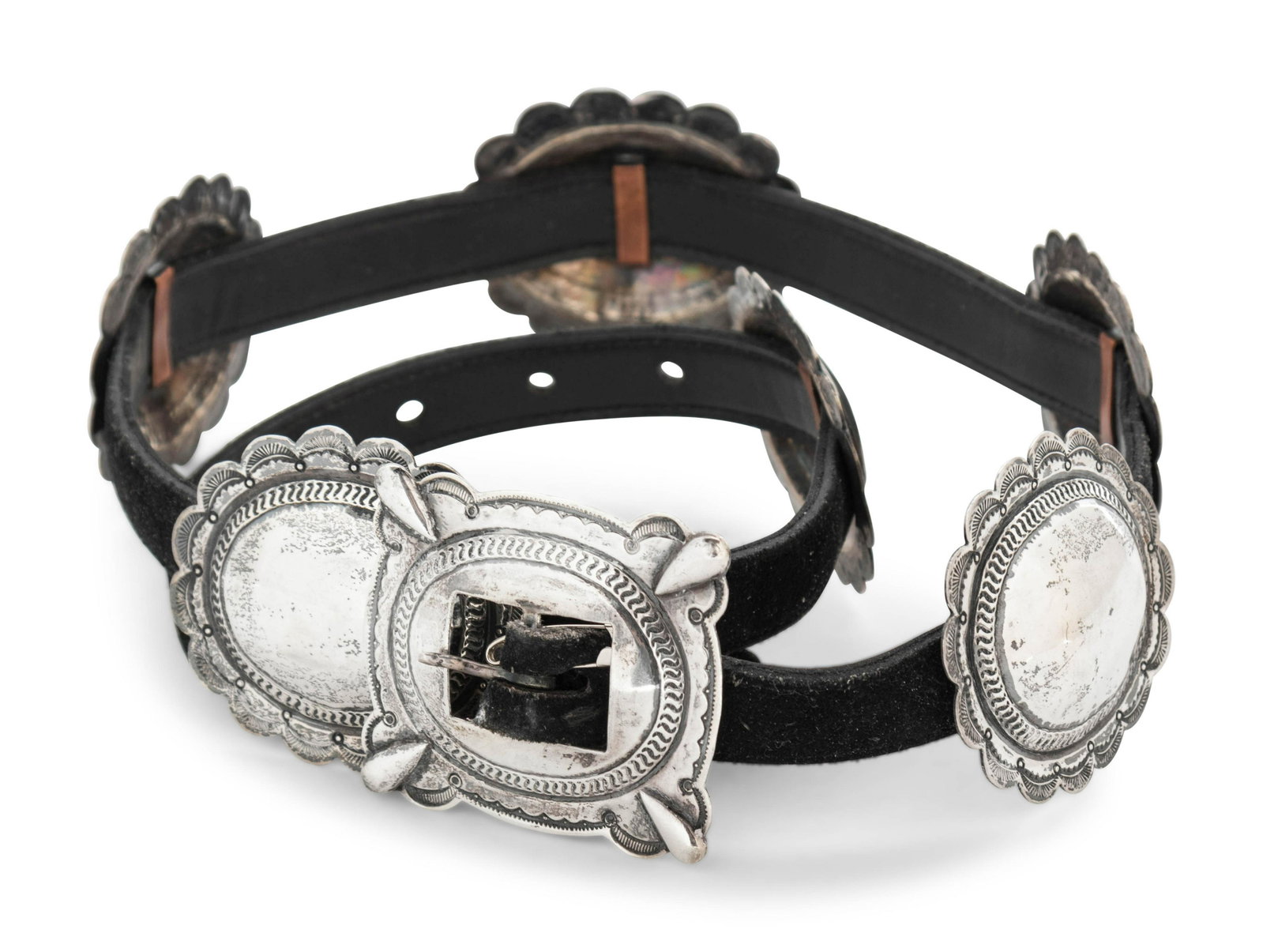 A Southwestern Silver and Leather Belt: A Southwestern Silver and Leather Belt 20th Century stamped Sterling. Length 35 inches. Property from the Collection of Mary Southworth, Lake Forest, Illinois
