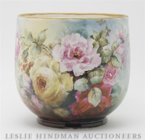 A French Porcelain Jardiniere, Limoges, Height 9 i: A French Porcelain Jardiniere, Limoges, having painted rose decoration throughout, with gilt rim. Height 9 inches. Property from the Estate of Ernest Trova, St. Louis, Missouri