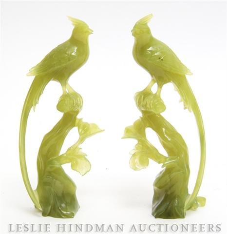 A Pair of Chinese Carved Hardstone Birds, Height 7: A Pair of Chinese Carved Hardstone Birds, modeled sitting on a tree branch. Height 7 1/8 inches.