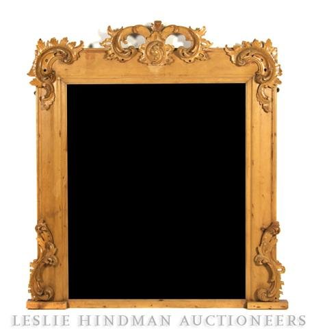 A Louis XV Style Pier Mirror, Height 60 1/2 x widt: A Louis XV Style Pier Mirror, having a rectangular beveled plate within a frame, having applied carved Rococo scrolls throughout. Height 60 1/2 x width 55 1/2 inches.