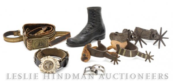 A Collection of Decorative Articles, Height of tal: A Collection of Decorative Articles, comprising a belt, a pair of suspenders, two pairs of spurs, a pair of shoe buckles, and a cast iron boot, eight items total. Height of tallest 6 1/4 inches. South