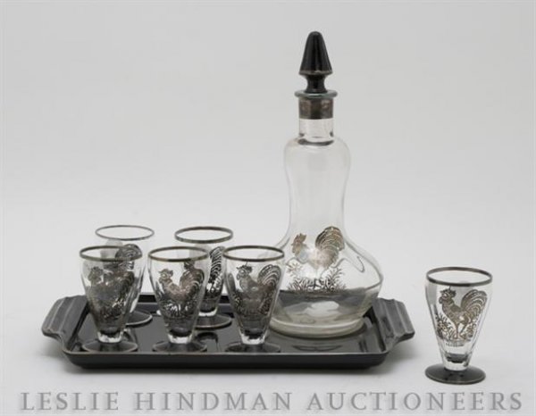 A Silver Overlay Decanter Set with Tray,: A Silver Overlay Decanter Set with Tray, having rooster form decoration.