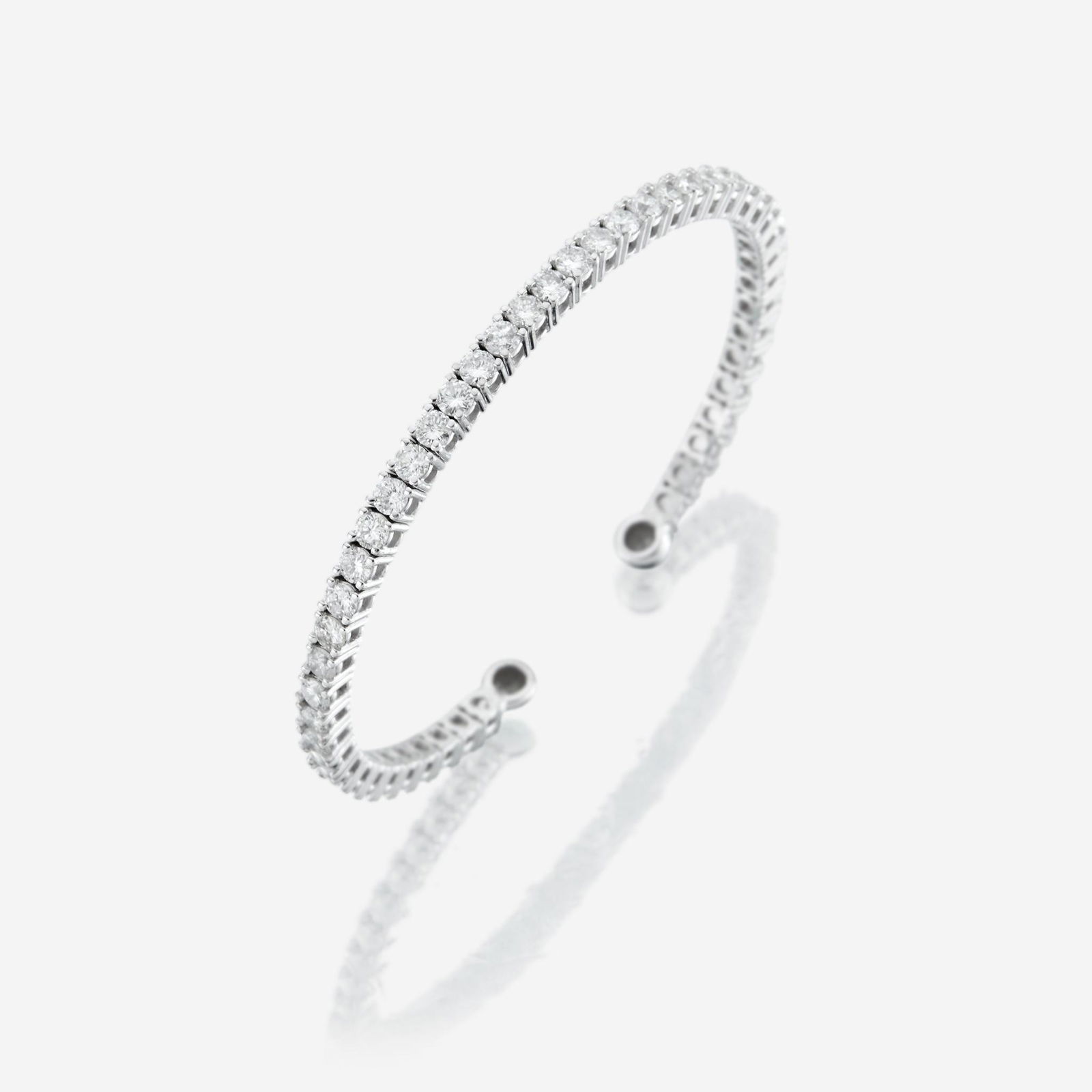 A diamond and fourteen karat white gold cuff bangle (1 of 1)