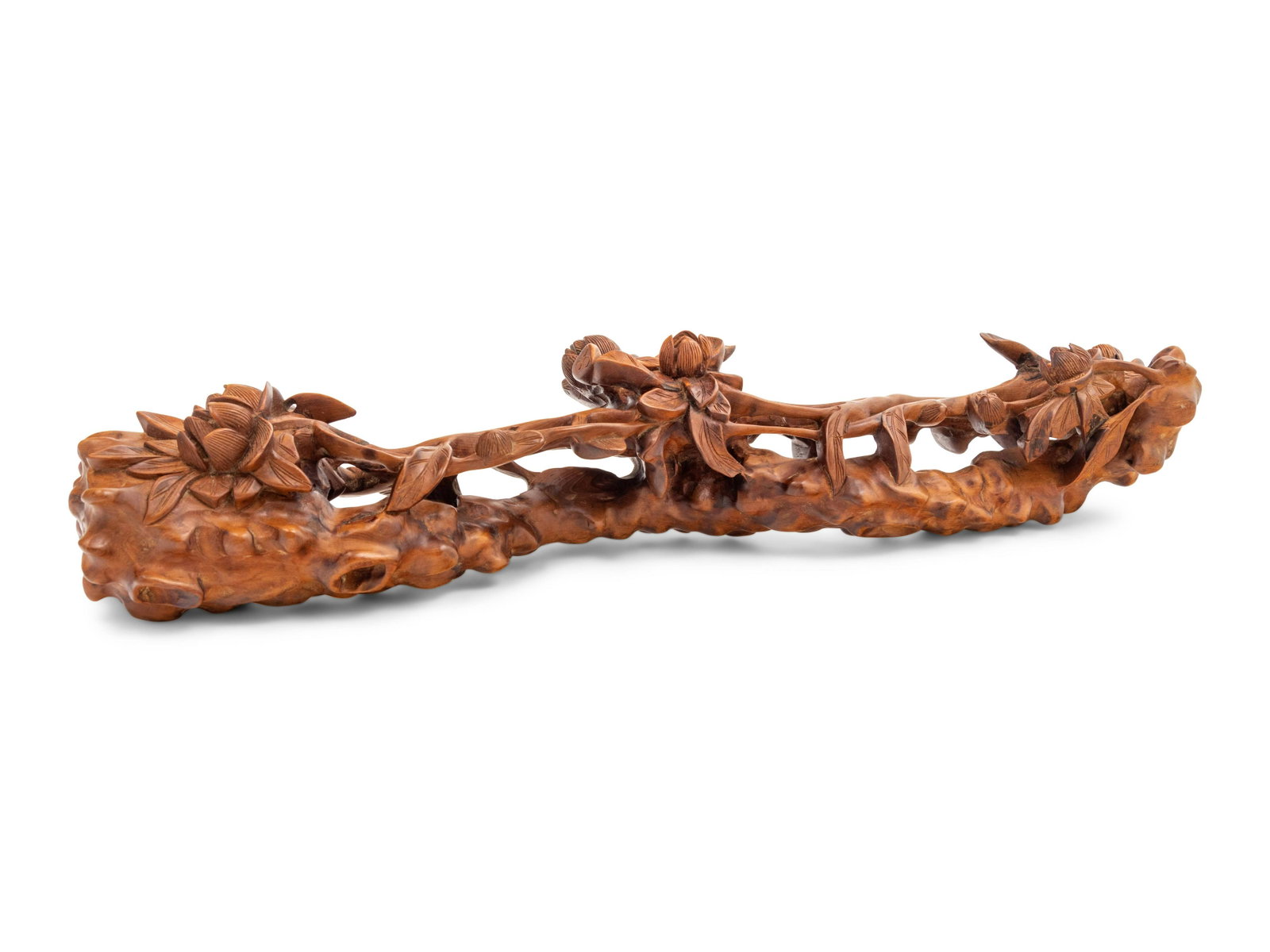 A Chinese Hardwood Carving of Peonies: A Chinese Hardwood Carving of Peonies MODERN of elongated form, rendered in openwork to suggest a slender ruyi scepter resting above a stand. Length 15 1/2 in., 39.5 cm.