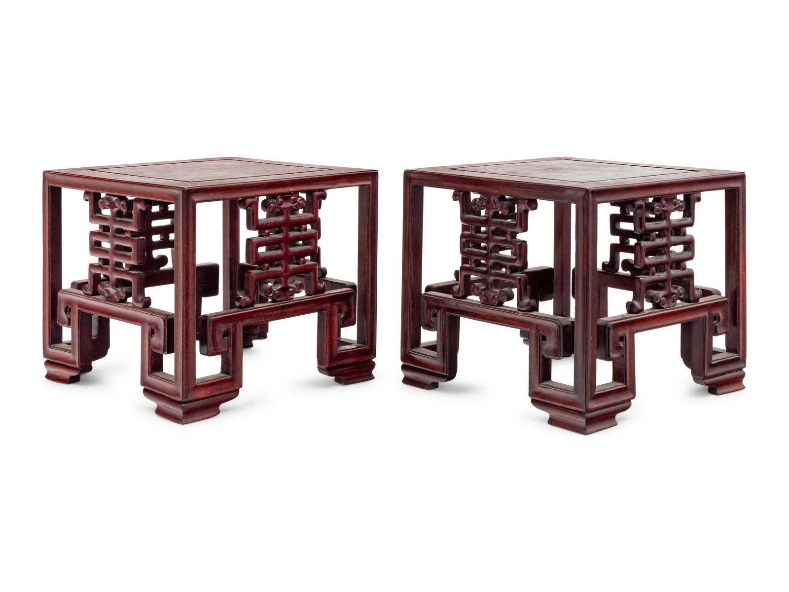 A Pair of Chinese Rosewood Square Stands: A Pair of Chinese Rosewood Square Stands 20TH CENTURY each having a metered top supported by stylized shou- characters aprons above lattice feet. Height 8 in., 20.2 cm.