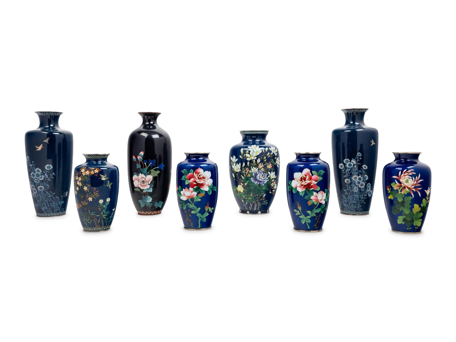 Eight Japanese Blue Ground Cloisonné Enamel and: Eight Japanese Blue Ground Cloisonné Enamel and Embossed Foil 'Ginbari' Vases 20TH CENTURY each of baluster form with a trumpeted mouth supported by a short neck, worked with polychrome verdant f