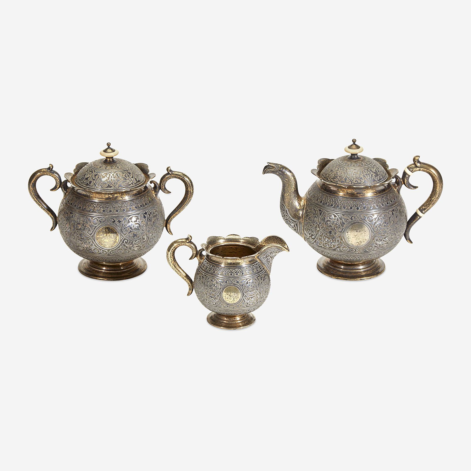 A Russian Parcel-Gilt Silver and Niello Three-Piece Tea (1 of 1)