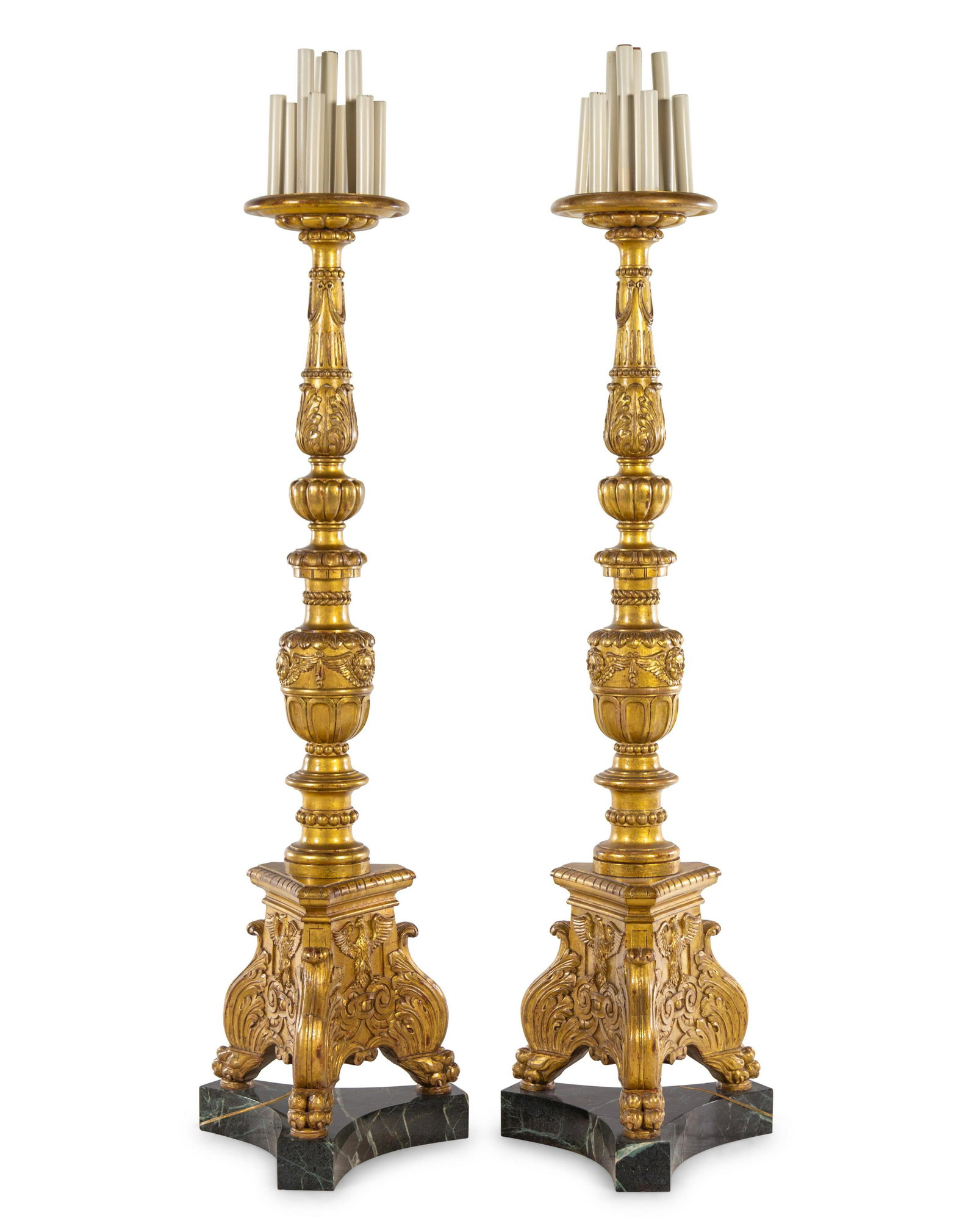 A Pair of Italian Baroque Style Giltwood Torcheres: A Pair of Italian Baroque Style Giltwood Torcheres First Half 20th Century electrified. Height overall (to top of drip pans) 75 1/4 inches. Property from the Estate of Norma and David McIntyre, Los An