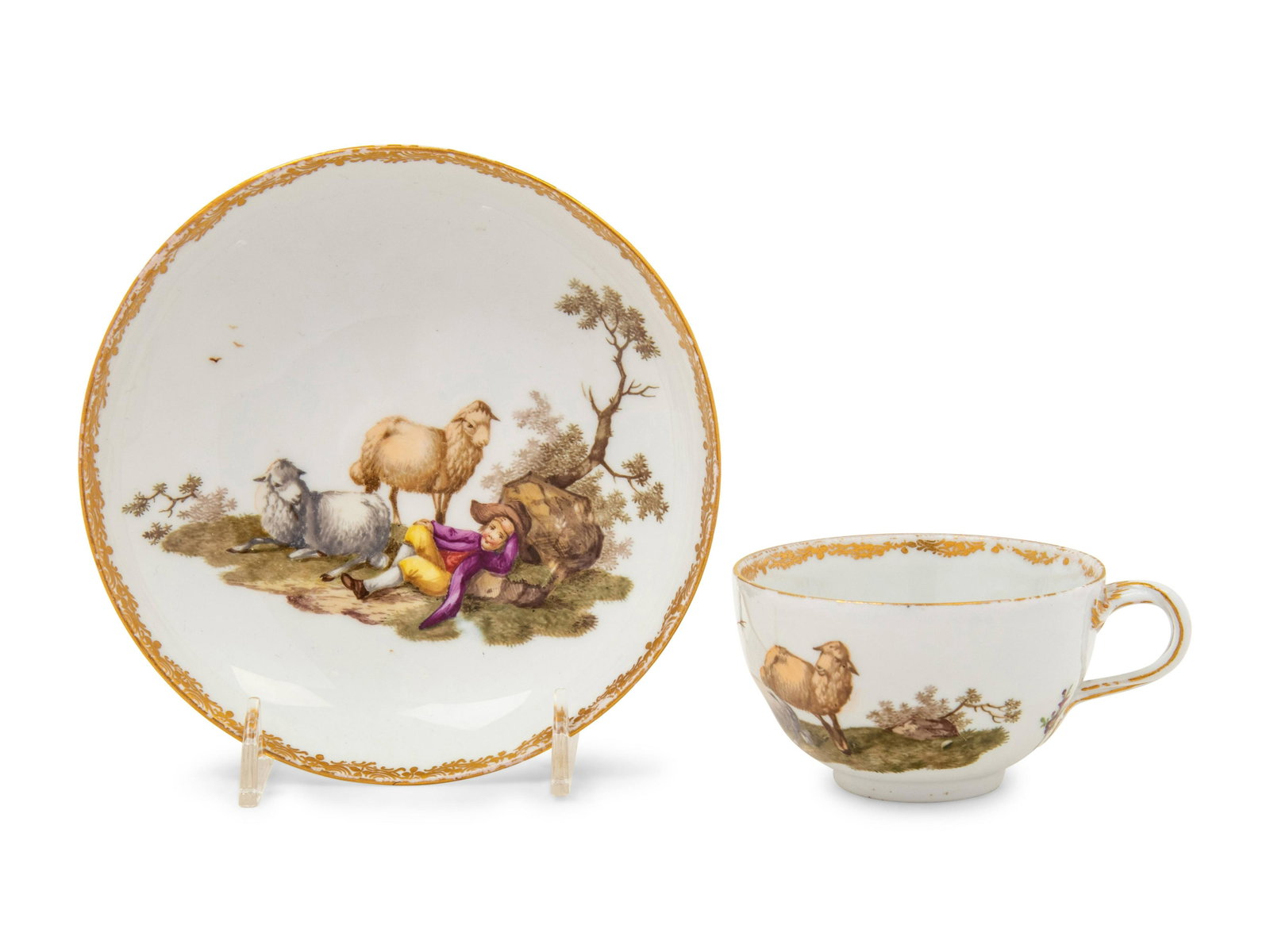 A Meissen Porcelain Cup and Saucer: A Meissen Porcelain Cup and Saucer Academic "Dot" Period, Circa 1760s each bearing crossed swords with a dot between crosspieces in underglaze blue, the saucer further marked B in underglaze blue, the