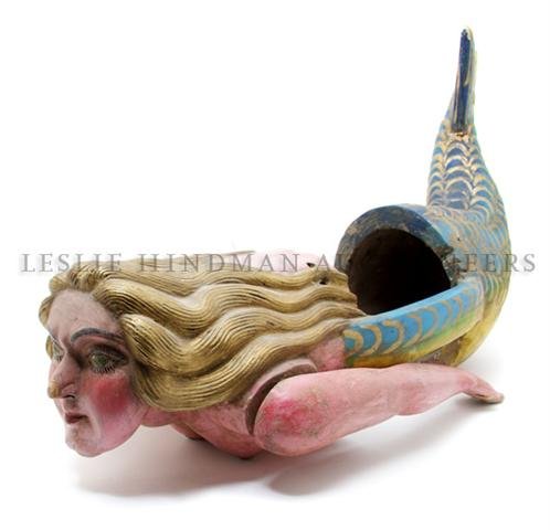 A Folk Art Carved Wood and Polychrome Decorated Fi