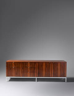 Florence Knoll (American, 1917-2019) Credenza: Florence Knoll (American, 1917-2019) Credenza Knoll Associates, USA rosewood, chrome-plated steel manufacturer's label to back H 25 1/2 x W 74 1/2 x 18 1/4 inches.