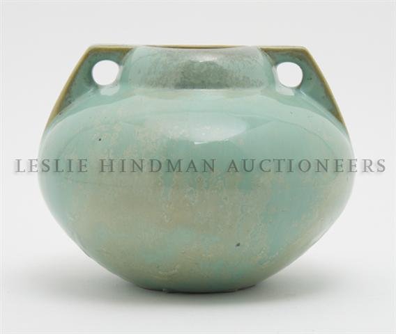 An American Fulper Pottery Vase, Height 6 inches.: An American Fulper Pottery Vase, having a green glaze, of a squat bulbous form having two handles, the base stamped Fulper in black ink. Height 6 inches.