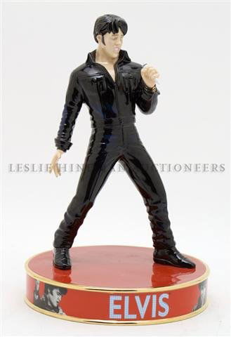 A Royal Doulton Figurine of Elvis Presley, Height 9 3/4: A Royal Doulton Figurine of Elvis Presley, Stand Up depicted in a standing pose with a microphone in hand raised on a circular base, EP2, limited edition 43/2500. Height 9 3/4 inches.