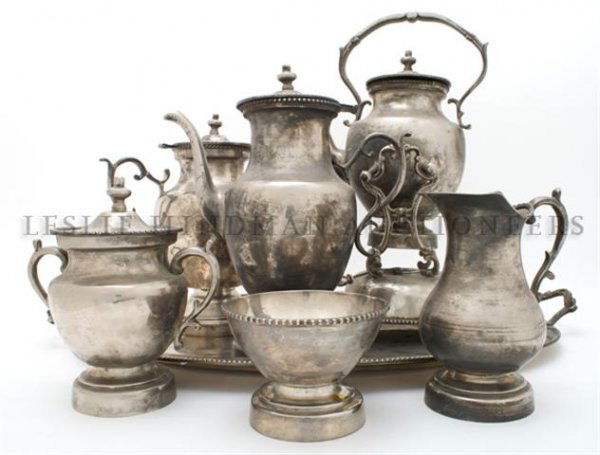 A Silverplate Coffee and Tea Service, Maker Unknown, Wi: A Silverplate Coffee and Tea Service, Maker Unknown, comprising a tray, a hot water kettle on stand, a coffee pot, a teapot, a covered sugar, a creamer and a waste bowl. Width of first 24 inches. Prop