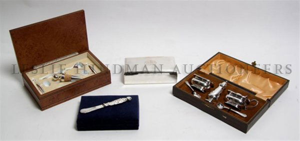 An English Cased, Salt, Pepper and Mustard Set, Width o: An English Cased, Salt, Pepper and Mustard Set, together with a cased cocktail set, four boxed knives and a silverplate box. Width of first overall 9 3/4 inches. Property from the Estate of Mrs. John
