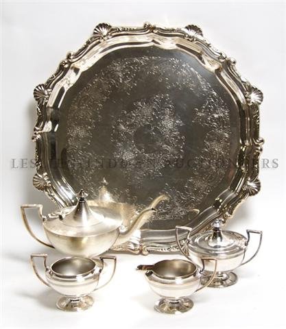 An English Silverplate Tea Service, Foster Stevens and : An English Silverplate Tea Service, Foster Stevens and Co., comprising a teapot, creamer, sugar and waste bowl, together with an associated tray. Height of first 6 1/2 inches. Property from the Estate