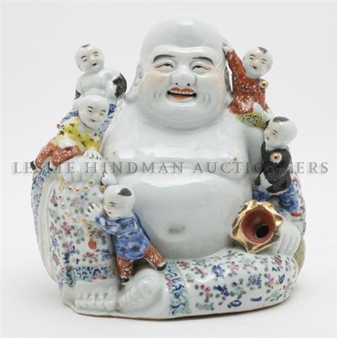 A Chinese Ceramic Figure of Buddha, Height 10 1/2 inche: A Chinese Ceramic Figure of Buddha, depicted smiling and having small children climbing on him. Height 10 1/2 inches. Property from the Collection of Mr. Peter Linder, Calgary, Alberta, Canada