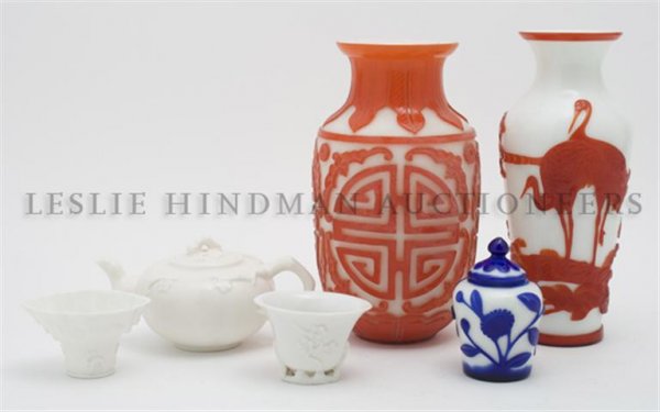 A Group of Six Chinese Glass Articles, Height of talles: A Group of Six Chinese Glass Articles, two having red overlay decoration and one with blue overlay decoration, together with a teapot decorated with cherry blossoms and two low vases. Height of talles
