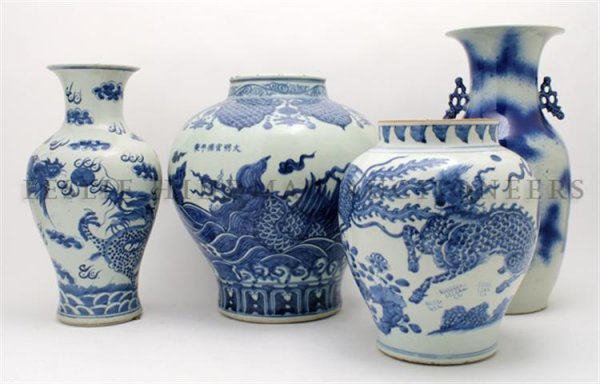 A Group of Four Asian Blue and White Vases, Height of t: A Group of Four Asian Blue and White Vases, of various forms, each having dragon form decoration. Height of tallest 17 inches. Property from the Estate of Mr. Melvin Bullard, Chicago, Illinois