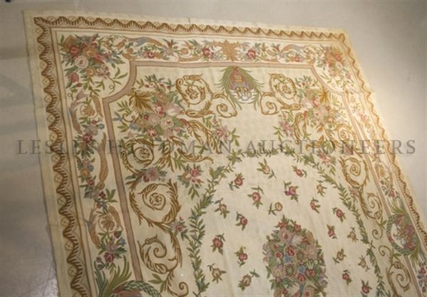 An Indian Carpet, 12 feet 4 inches x 9 feet 2 inches.: An Indian Carpet, in the Aubusson style, with central medallion. 12 feet 4 inches x 9 feet 2 inches.
