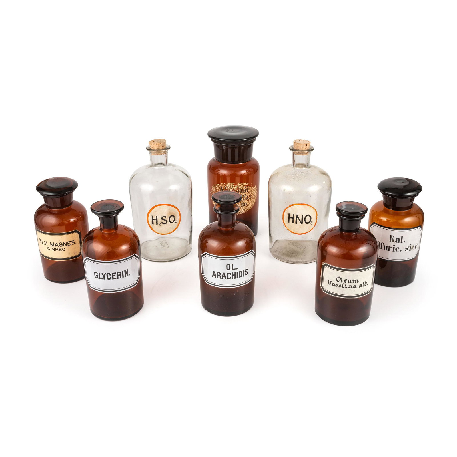 Eight Amber and Colorless Glass Apothecary Jars: Eight Amber and Colorless Glass Apothecary Jars Late 19th/Early 20th Century labeled for various drugs. Height of tallest 10 inches. 