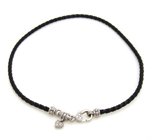 An 14 Karat White Gold, Diamond and Braided Leather Nec: An 14 Karat White Gold, Diamond and Braided Leather Necklace, Judith Ripka, containing six round brilliant cut diamonds weighing approximately 0.20 carat total. 9.40 dwts.