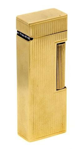 A 14 Karat Yellow Gold Lighter, Dunhill. 53.10 dwts.: A 14 Karat Yellow Gold Lighter, Dunhill. Stamp: DUNHILL 14K CASE. Accompanied by original leather sheath. 53.10 dwts. Property of Julie Heidt, Chicago, Illinois