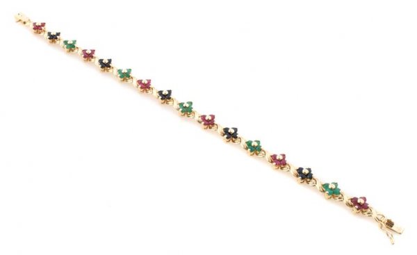 A 14 Karat Yellow Gold, Emerald, Ruby and Blue Sapphire: A 14 Karat Yellow Gold, Emerald, Ruby and Blue Sapphire Bracelet. 7.00 dwts.