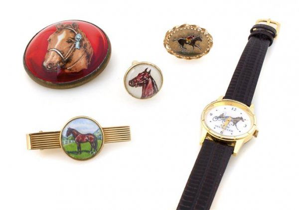 A Group of Horse Motif Jewelry, 50.53 dwts.: A Group of Horse Motif Jewelry, consisting of a pair of reverse intaglio cufflinks in 14 karat yellow gold, a 14 karat yellow gold tie pin, a gold tone watch, a horse motif brooch with foil backing an