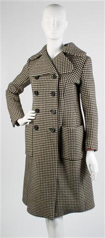 A Norman Norell Black and White Houndstooth Coat,: A Norman Norell Black and White Houndstooth Coat, 1960s, double breasted with a notched collar, swing fit, together with a matching skirt. Labeled: Norell.
