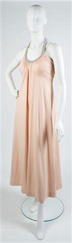 A Donald Brooks Peach Jersey Evening Gown,: A Donald Brooks Peach Jersey Evening Gown, 1970s, with pearl and bead neckline and straps. Labeled: Boutique Donald Brooks.