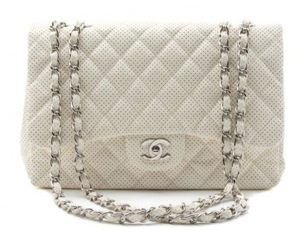A Chanel White Perforated Quilted Leather Bag, 12 x 8 i: A Chanel White Perforated Quilted Leather Bag, with logo flap closure, adjustable chainlink strap. Stamped: Chanel. 12 x 8 inches.