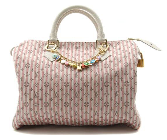 A Louis Vuitton Pink Striped Cotton Canvas Speedy Bag w: A Louis Vuitton Pink Striped Cotton Canvas Speedy Bag with Charm Keychain, with logo canvas, white leather handles, logo enameled keychain. Stamped: Louis Vuitton. 12 x 9 inches. Property of Julie Hei