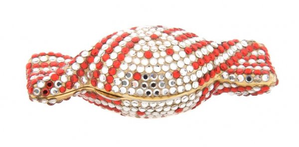 A Judith Leiber Candy Pill Box,: A Judith Leiber Candy Pill Box, with red and clear rhinestones set in goldtone. Stamped: Judith Leiber. Property from the Estate of Norma Seidman, Lincolnwood, Illinois