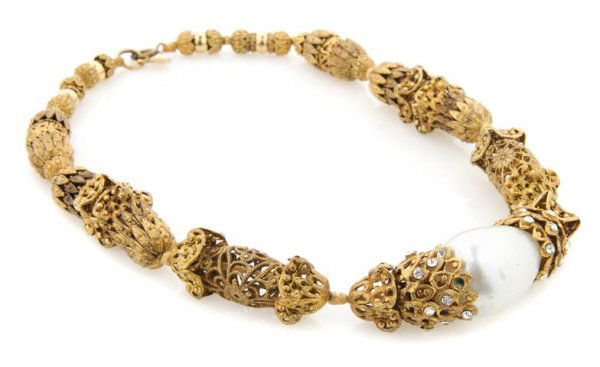 A Chanel Goldtone Byzantine Necklace,: A Chanel Goldtone Byzantine Necklace, mid-century, probably Robert Goossens for Chanel, with an oversized faux pearl link flanked by rhinestones. Stamped: Chanel.