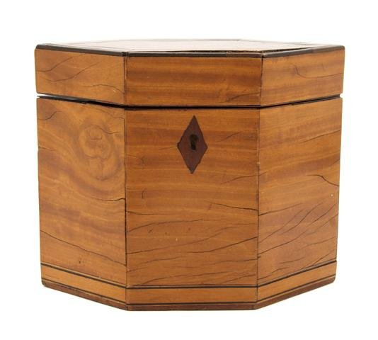 An English Satinwood Tea Caddy, Height 5 5/8 inches.: An English Satinwood Tea Caddy, 19th century, of elongated hexagonal form, with inlaid banding and escutcheon. Height 5 5/8 inches.