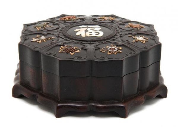 A Chinese Hardwood Covered Box, Diameter 7 1/2 inches.: A Chinese Hardwood Covered Box, of scalloped form, the top having inlaid decoration throughout with inlaid Buddhist emblems throughout of various materials, having inlaid mother-of-pearl character at 
