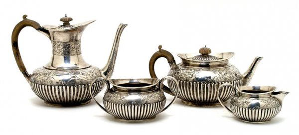A Four Piece English Silver Tea Set, Charles Johnston H: A Four Piece English Silver Tea Set, Charles Johnston Hill, London, 1889, comprising a teapot, coffee pot, sugar and creamer, having bands of scrolling foliate and griffin decoration, the coffee pot a
