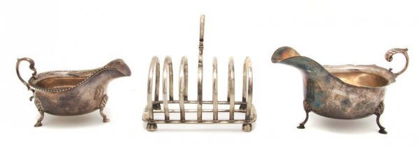 A Collection of Three English Silver Articles, Width of: A Collection of Three English Silver Articles, comprising a toast rack, William Hutton & Sons, London, 1906, a creamer, Williams Birmingham Ltd., Birmingham, 1911, and a creamer, Adie Brothers LTD, Bi