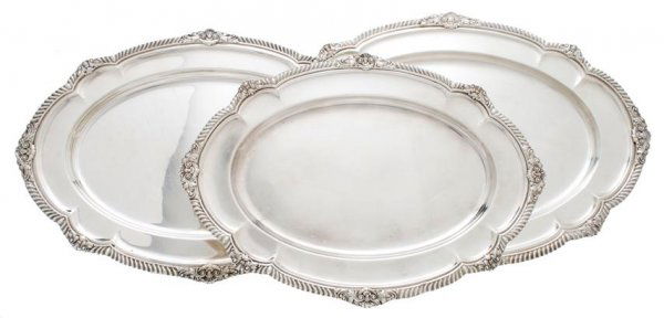 A Set of Three American Sterling Silver Graduated Trays: A Set of Three American Sterling Silver Graduated Trays, Gorham, each of oval form with gadrooned and foliate decorated border; approximate total weight 173.83 ozt. Width of widest 21 1/2 inches.