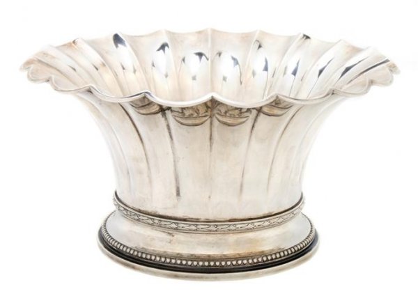 A Danish Sterling Silver Center Bowl, C. C. Hermann, Di: A Danish Sterling Silver Center Bowl, C. C. Hermann, the bowl of lobed, flaring form raised on the circular beaded foot; approximate weight 19.13 ozt. Diameter 9 1/8 inches.