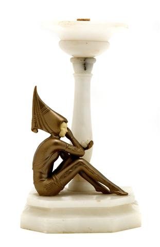 An Art Deco Style Alabaster Figural Lamp, Height 11 1/4: An Art Deco Style Alabaster Figural Lamp, depicting a seated female figure beneath the lighting element raised on a stepped base. Height 11 1/4 inches.
