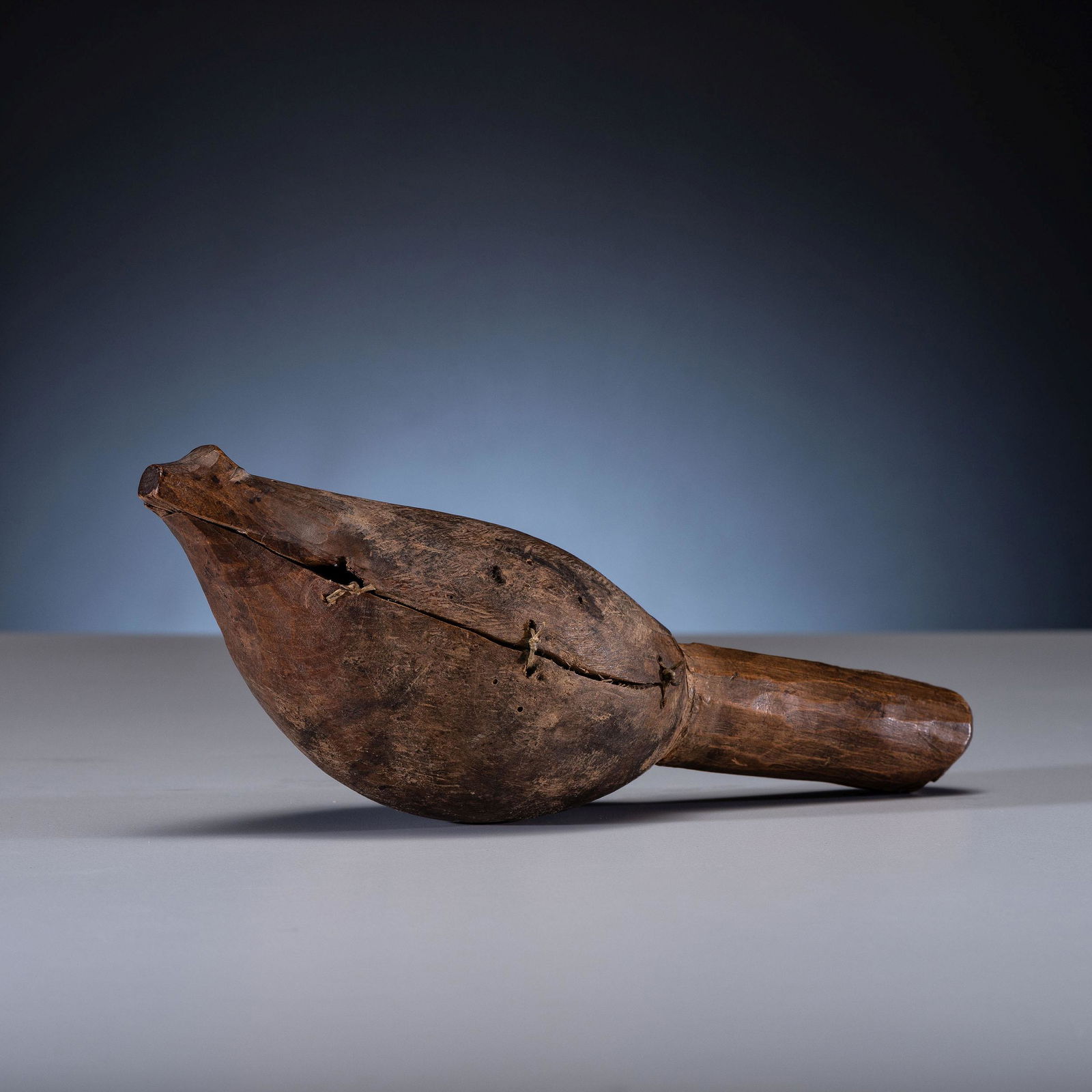 Nuu-chah-nulth Grouse Rattle: Nuu-chah-nulth Grouse Rattle fourth quarter 19th century formed from two pieces attached by sinew; high polish to handle length 10-1/2 inches Sold to Benefit the U.S. Children's Center on Historical E