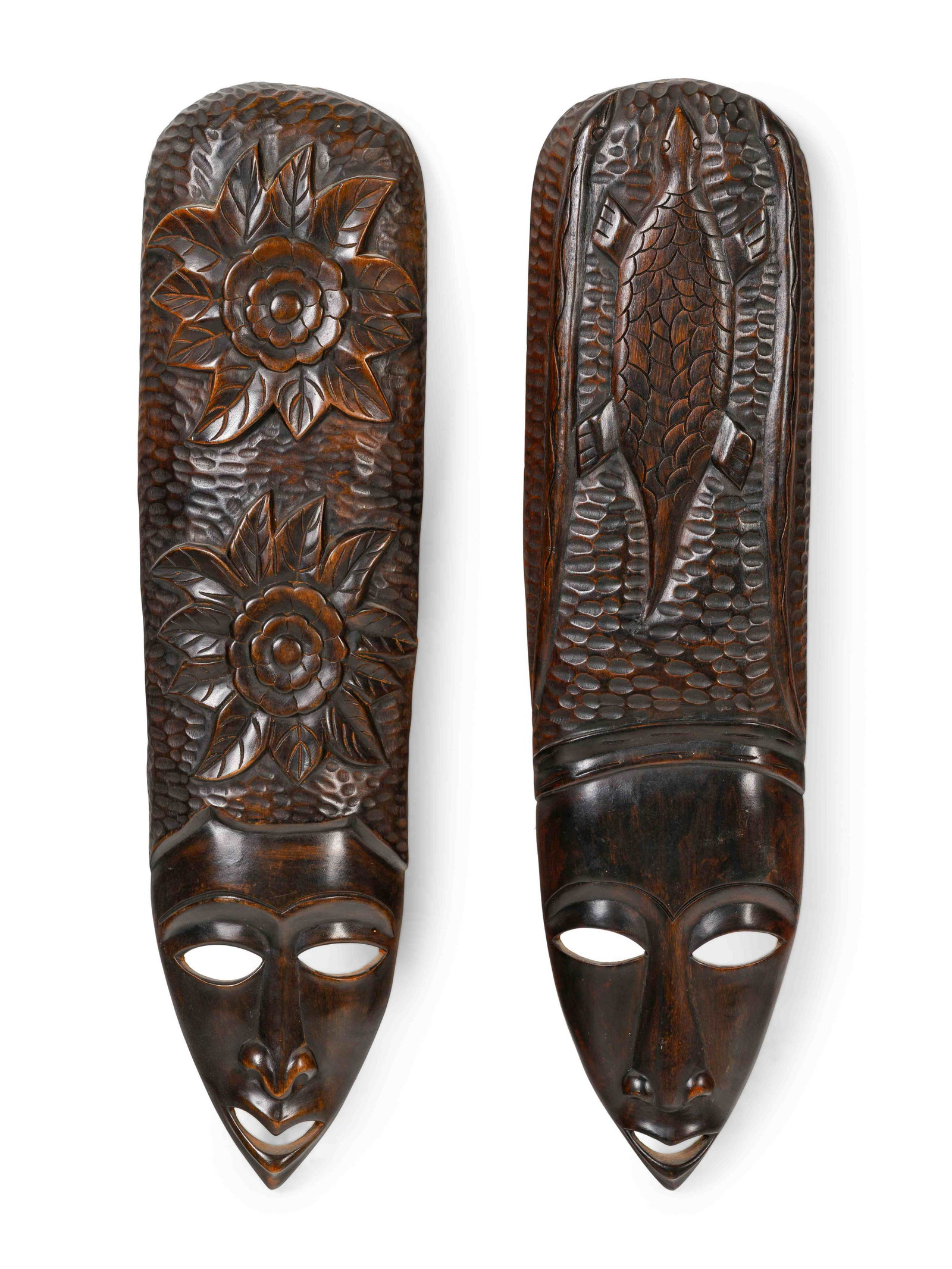 A Pair of African Carved Wood Masks: A Pair of African Carved Wood Masks Height 36 inches. Property from the Collection of Mavis Staples, Chicago, Illinois