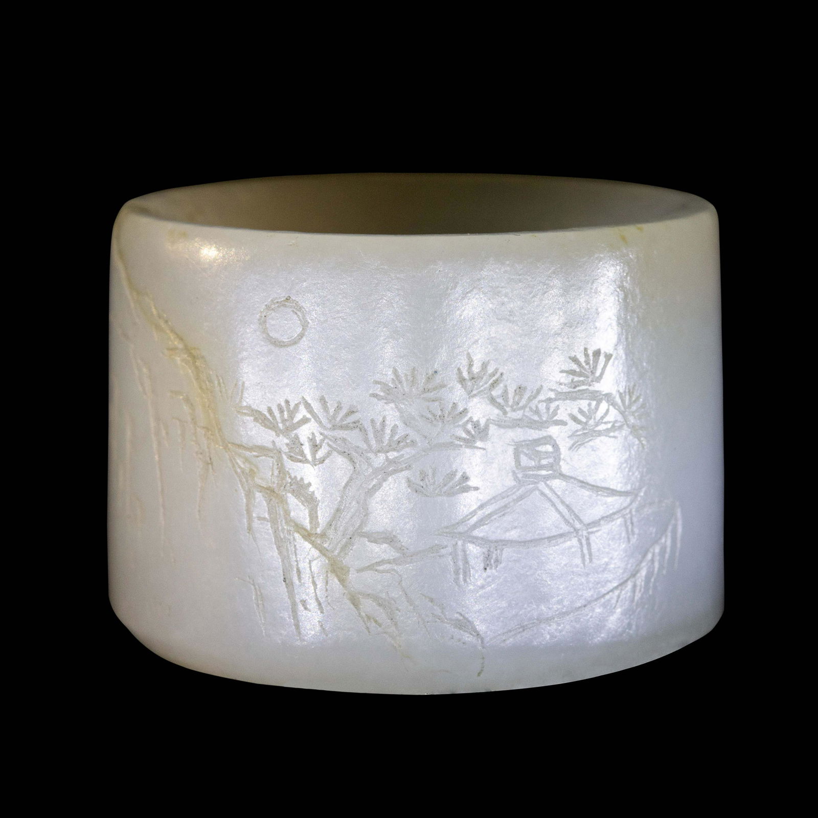 An Incised White Jade 'Landscape' Archer's Ring (1 of 3)
