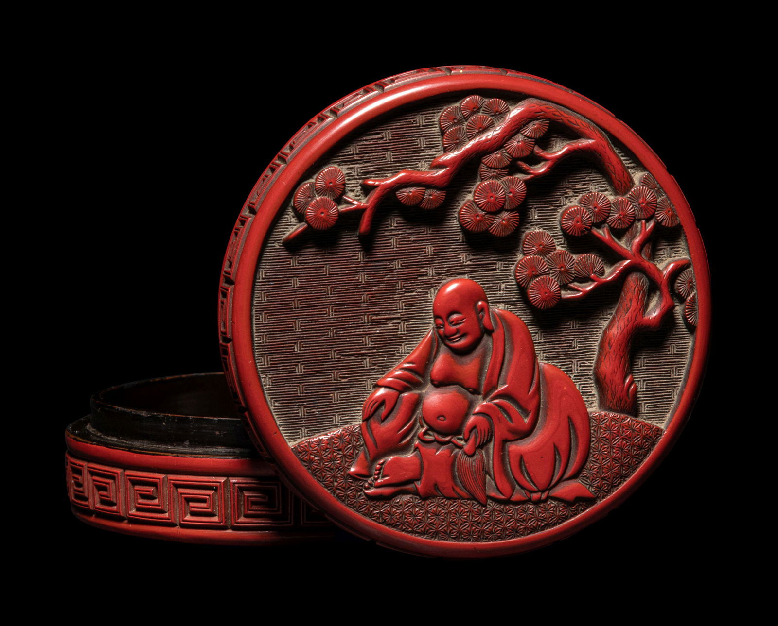 A Carved Cinnabar Lacquer 'Luohan' Circular Covered Box (1 of 3)