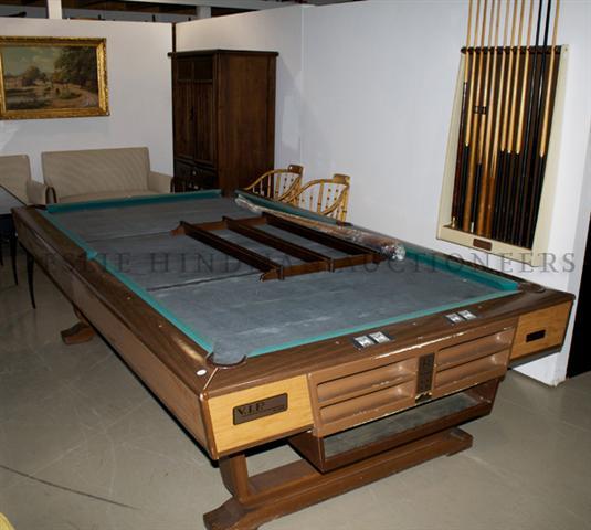 An American Brunswick Pool Table, Height 31 x width 112: An American Brunswick Pool Table, with balls, cue sticks and accessories. Height 31 x width 112 x depth 43 inches. Property from the Collection of Jeanne and Alvin Ruck, Inverness, Illinois