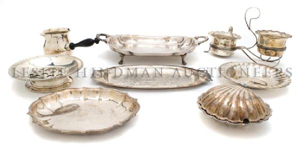 A Collection of Silverplate Serving Articles, Diameter : A Collection of Silverplate Serving Articles, comprising a center bowl, two trivets, a shell form dish and fourteen others. Diameter of first 10 1/2 inches.