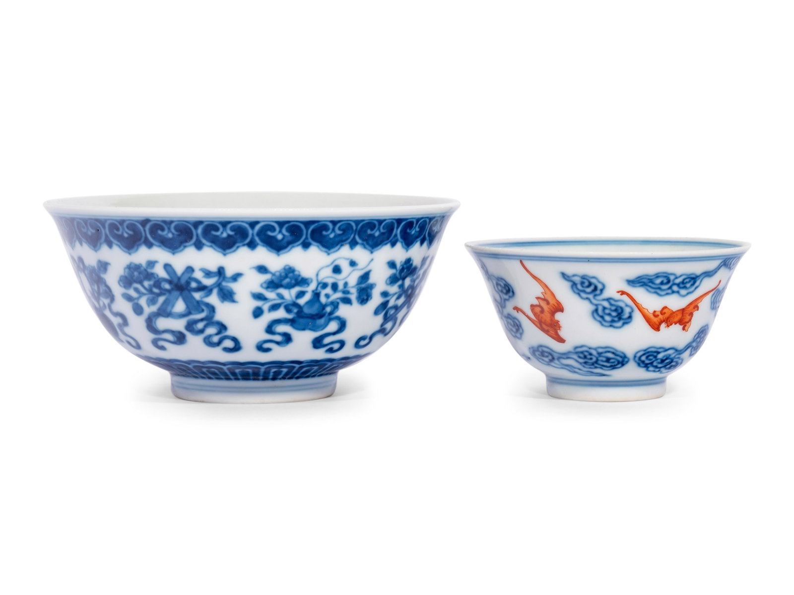 Two Chinese Blue and White Bowls: Two Chinese Blue and White Bowls each resting on a straight foot and rising to a gently everted rim, the first painting with the eight auspicious symbols' (bajixiang), the second painted with bats and